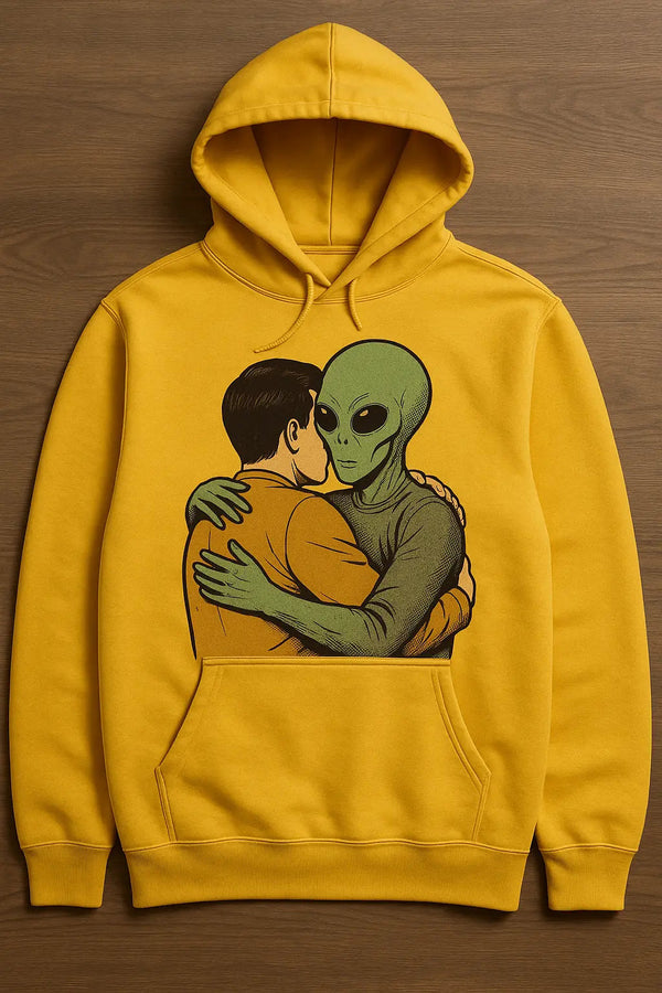 A person hugging a friendly alien printed on a yellow hoodie, an example of an anniversary shirt design
