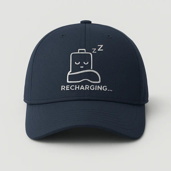 Funny graphic cap with a sleeping battery icon captioned Recharging